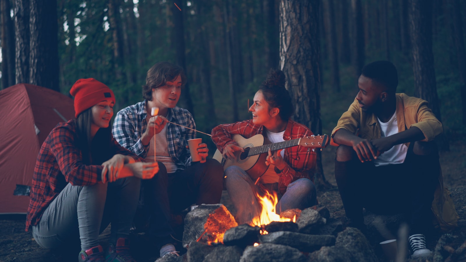 Travelers laughing together on a group trip